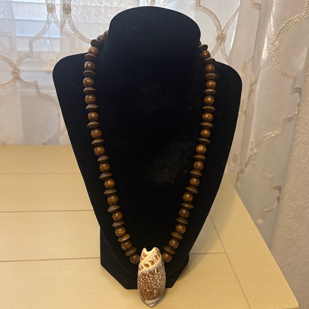 Elegant Brown Beaded Necklace with Shell Pendant